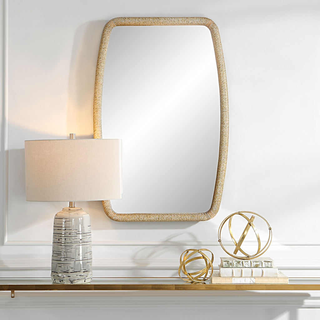 Introducing our exquisite mirror that effortlessly merges natural materials with timeless style. The wooden frame showcases a meticulously crafted wrapped woven rattan design, adding a touch of organic elegance to any space.- Alternate Image