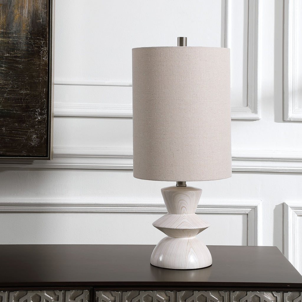 Introducing our exquisite buffet lamp, inspired by classic mid-century styling. Its geometric-shaped base, with a mesmerizing bleached wood tone finish, exudes timeless elegance.- Alternate Image