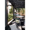 Crystorama Capsule 8'' Outdoor Sconce in Matte Black + Textured Gold - Lifestyle View