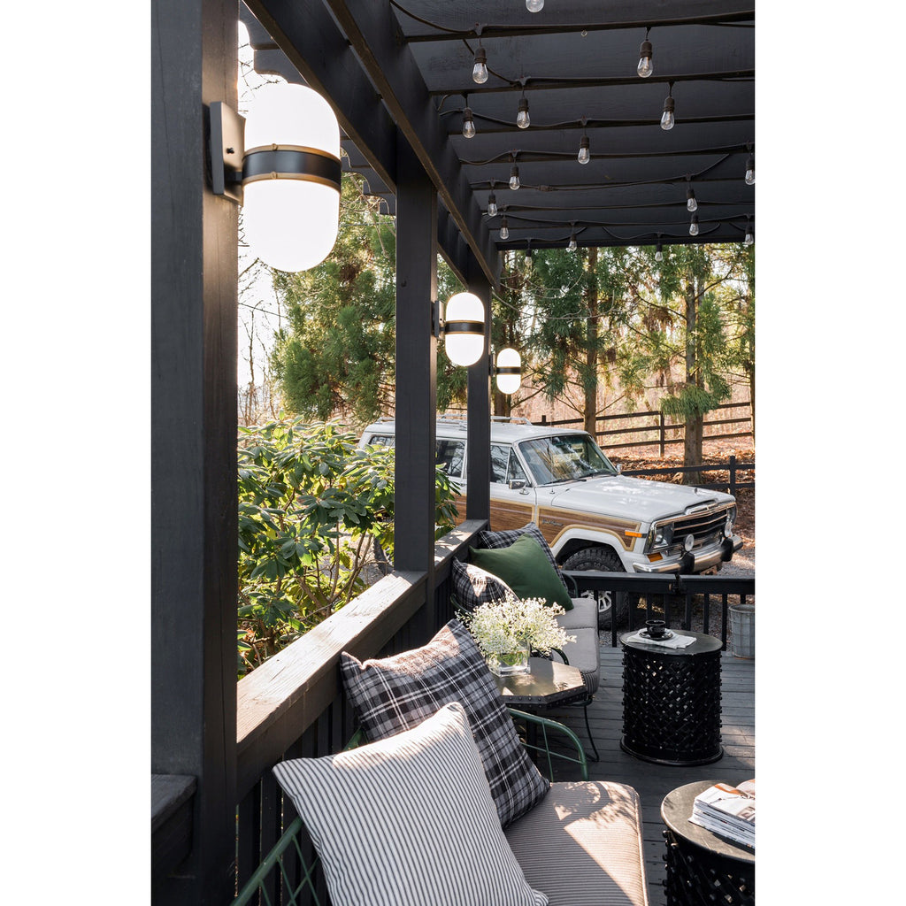 Crystorama Capsule 8'' Outdoor Sconce in Matte Black + Textured Gold - Lifestyle View