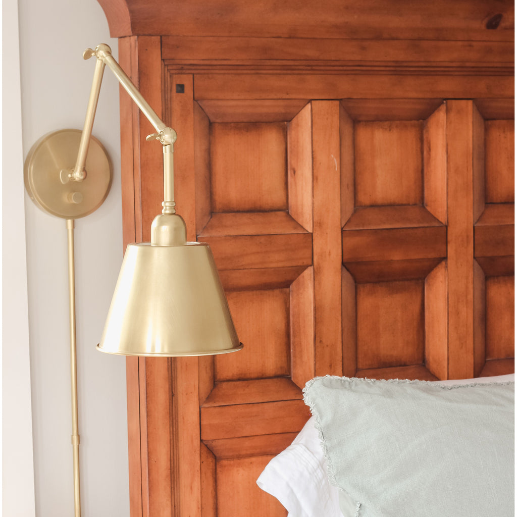 Crystorama Mitchell 7.25'' Task Sconce in Aged Brass - Lifestyle View