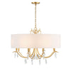 The Melrose and Madison drum chandelier boasts a timeless design that seamlessly fits into both traditional and modern interiors. Its antique gold finish beautifully complements the large white round silk shade, while the organic metal frame features elegant swooping arms and elongated crystal drops.